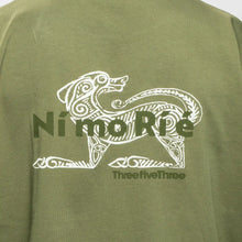 Green t-shirt with a white graphic and text on the back
