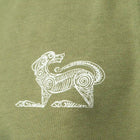 White printed design of a stylised animal on a green fabric background