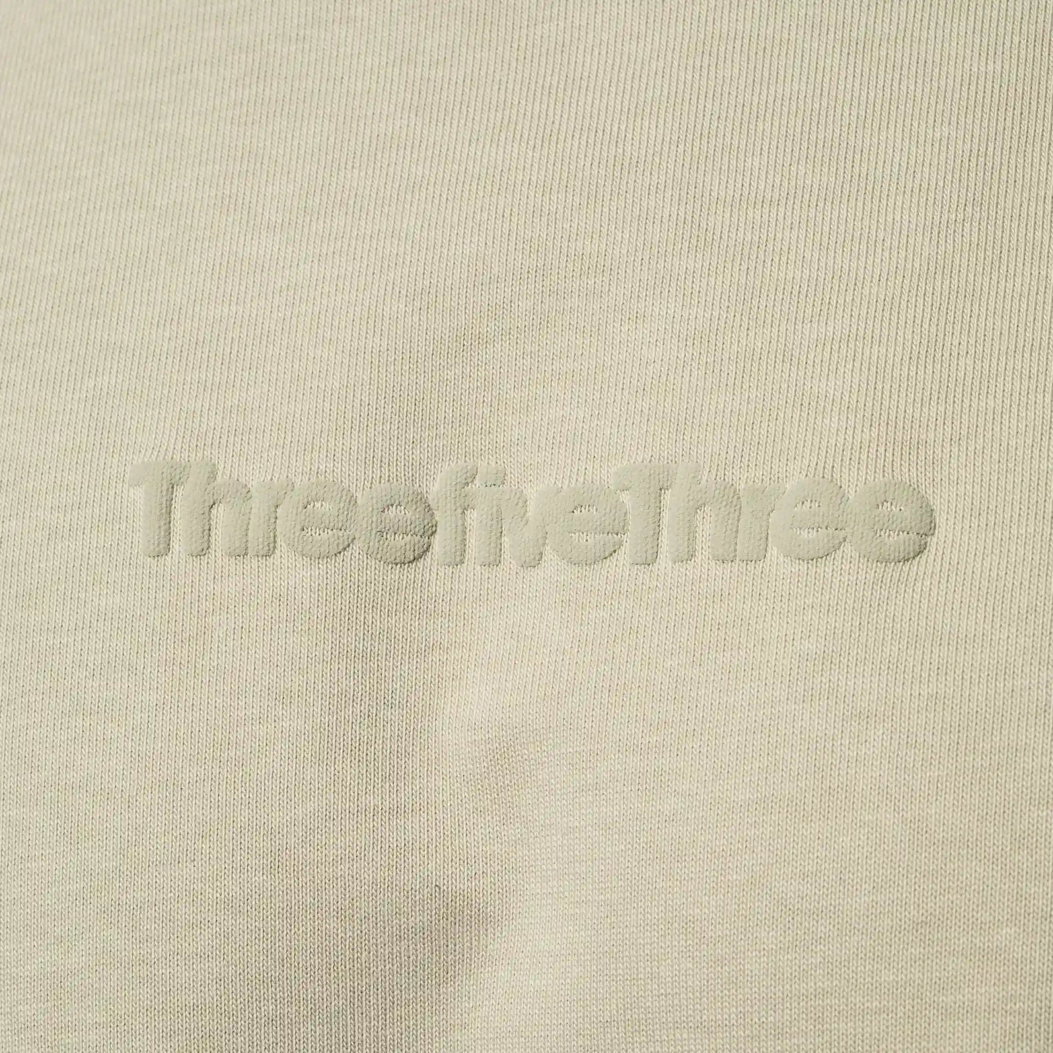 Beige fabric with 'ThreefiveThree' branding